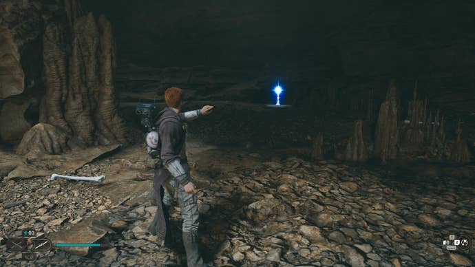 Star Wars Jedi Survivor screenshot showing Cal looking towards a perk in a dark alcove.