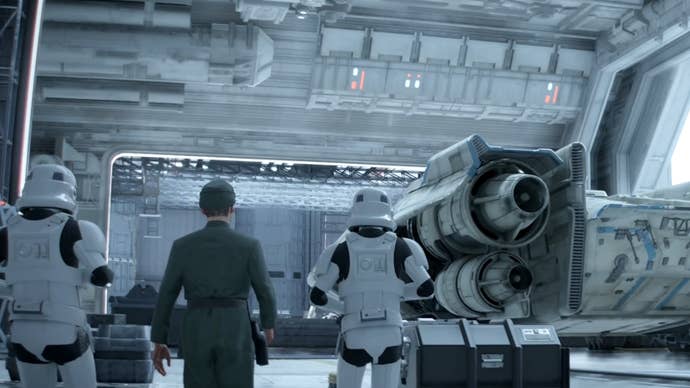 Two Stormtroopers and an Imperial officer looking at the Trailblazer ship in Star Wars Outlaws.