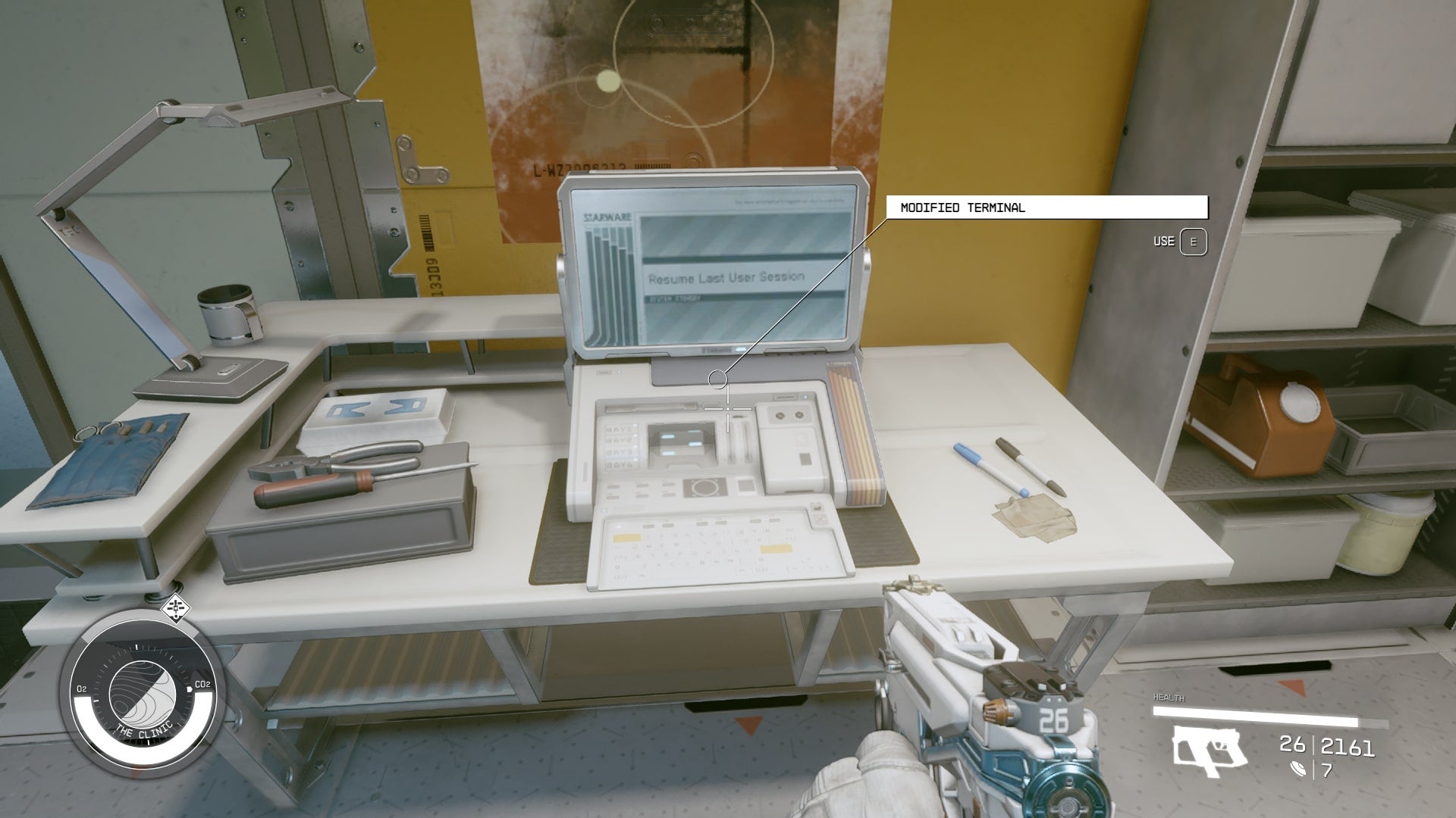 The player faces a computer terminal in Maya Cruz&rsquo;s room in the Clinic in Starfield