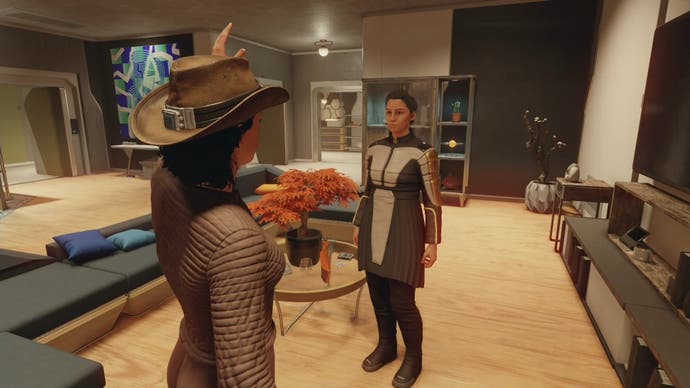 third person photo mode of female character waving at her mum