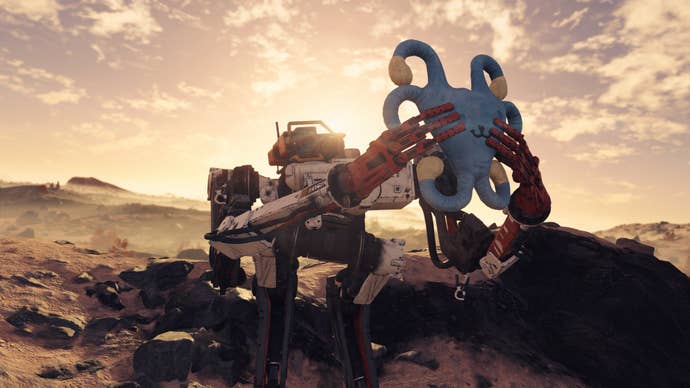 VASCO, Starfield’s robot companion, holds up a blue and yellow object as the sun sets behind him