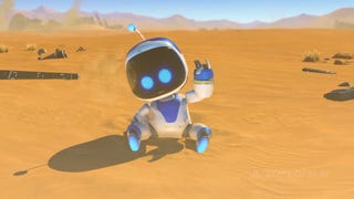 Astro Bot dusts itself off in a desert landscape.