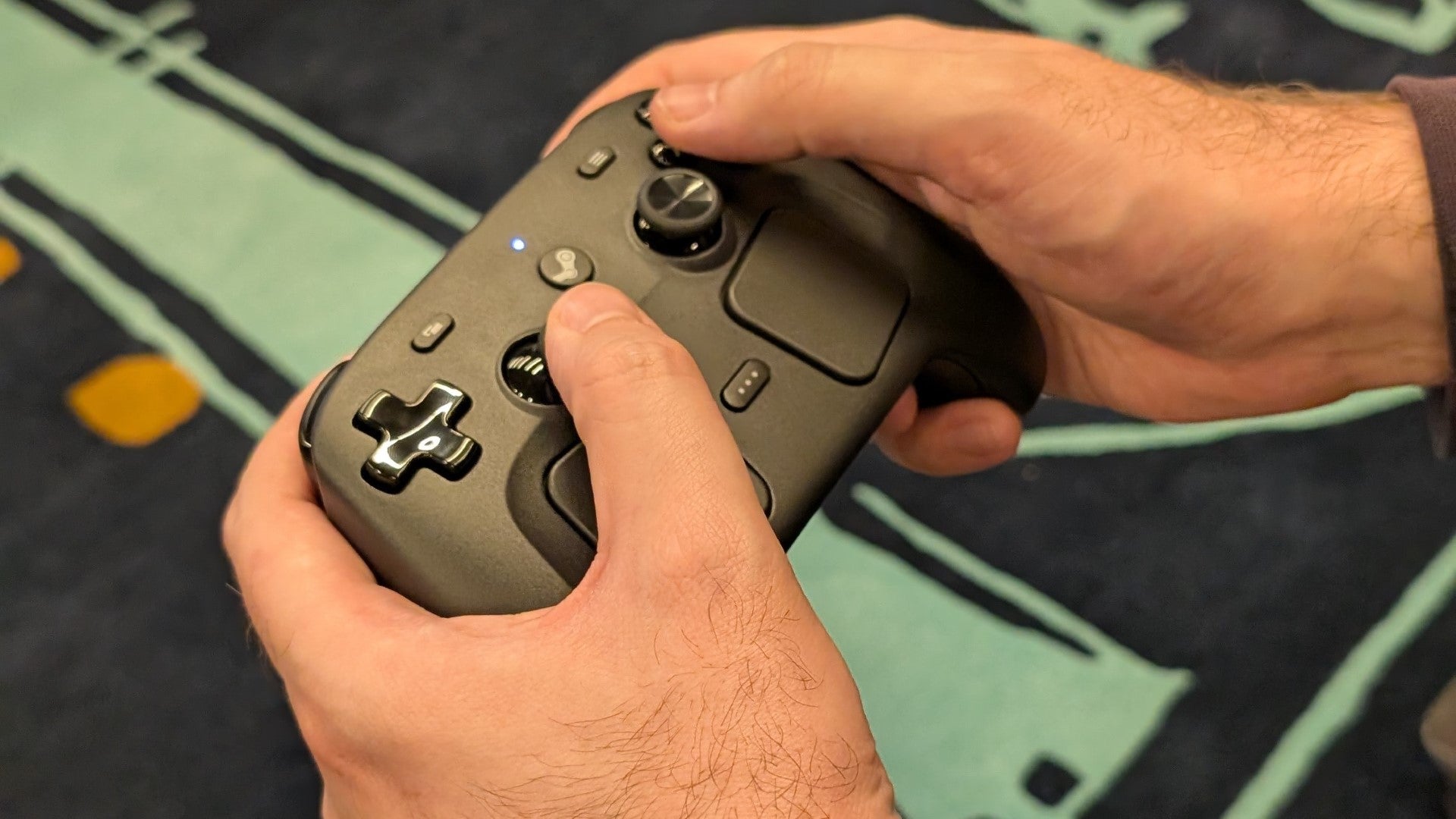 A Steam Controller being played. - 3