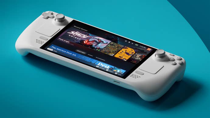 The Steam Deck OLED Limited Edition White, sat connected a bluish table.
