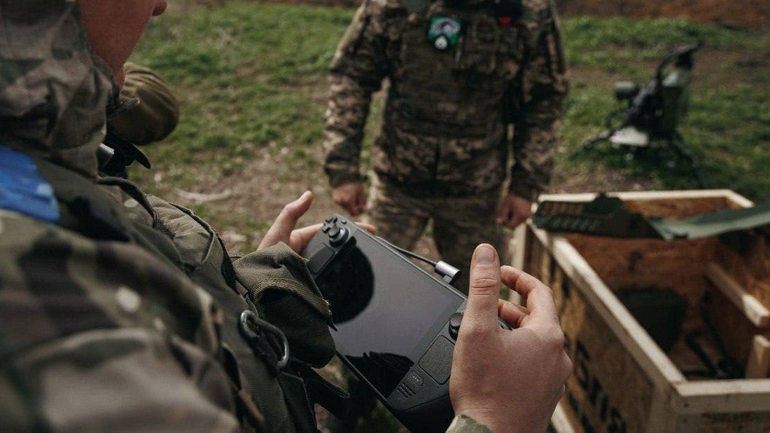 A Steam Deck being used to control a machine gun turret - 1