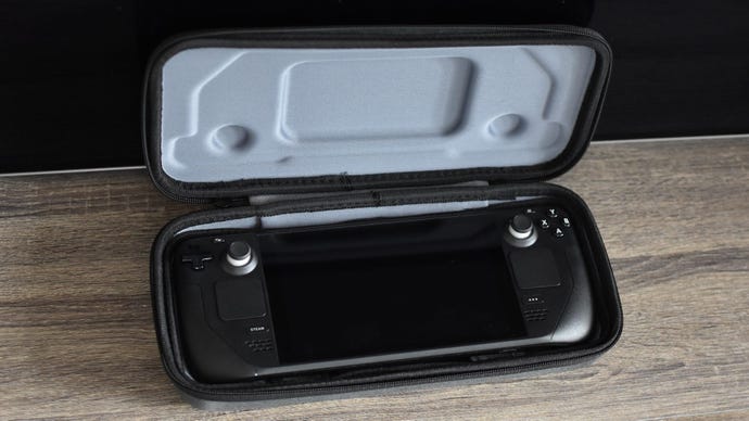 A Steam Deck inside a hard carry case, which is propped open.