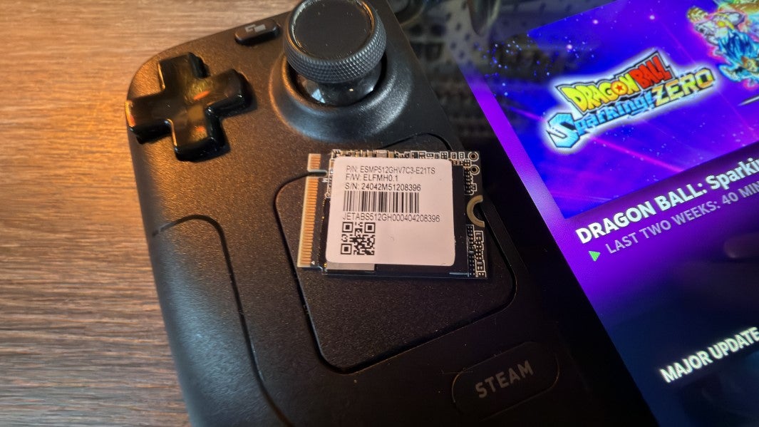 The stock Steam Deck OLED 1TB SSD, sat on top of a Steam Deck.