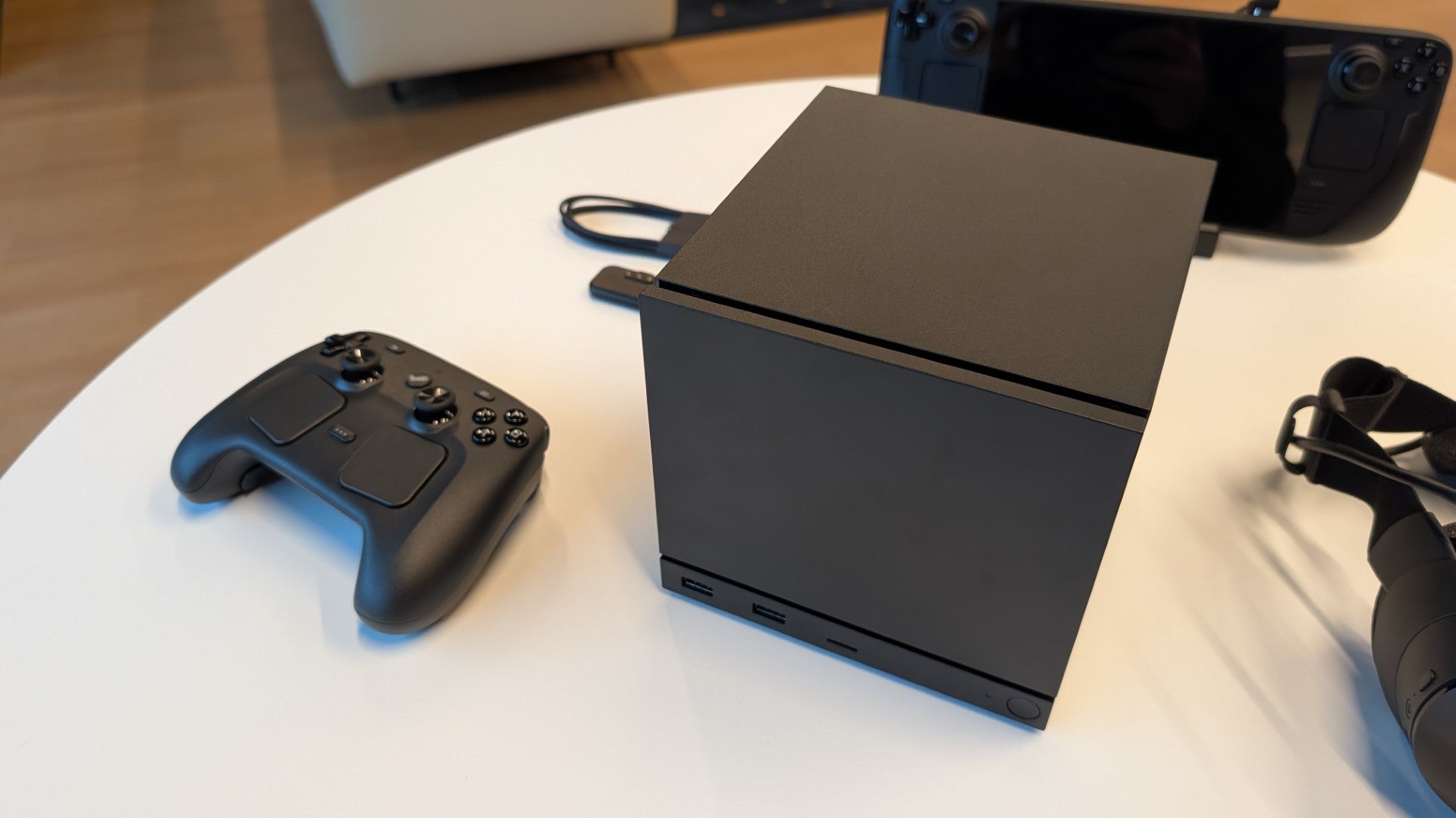 The new, 2026 Valve Steam Machine next to the redesigned Steam Controller. - 3