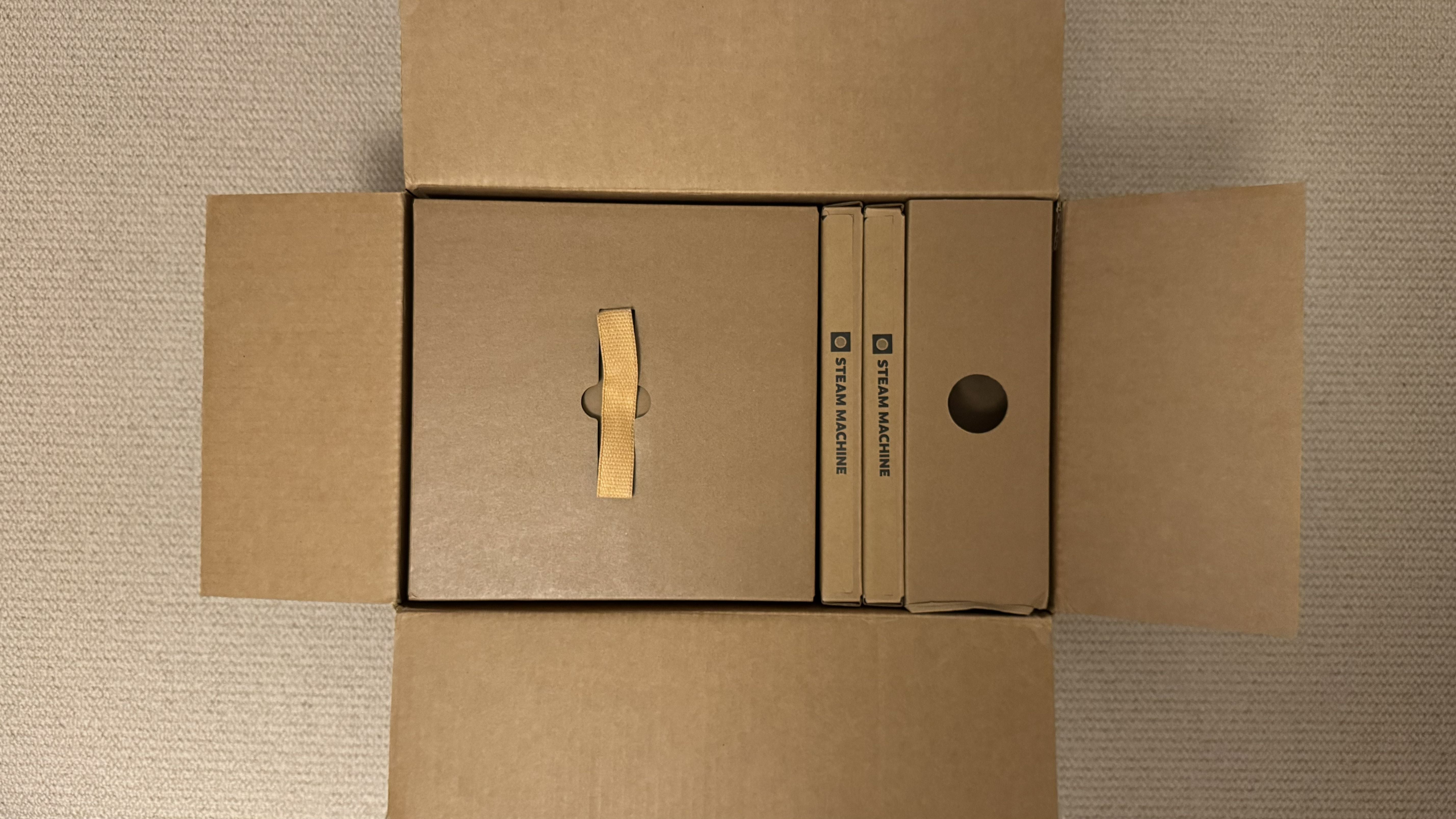 Photograph of the Steam Machine boxes as they arrive for shipping, outer box only opened, top down