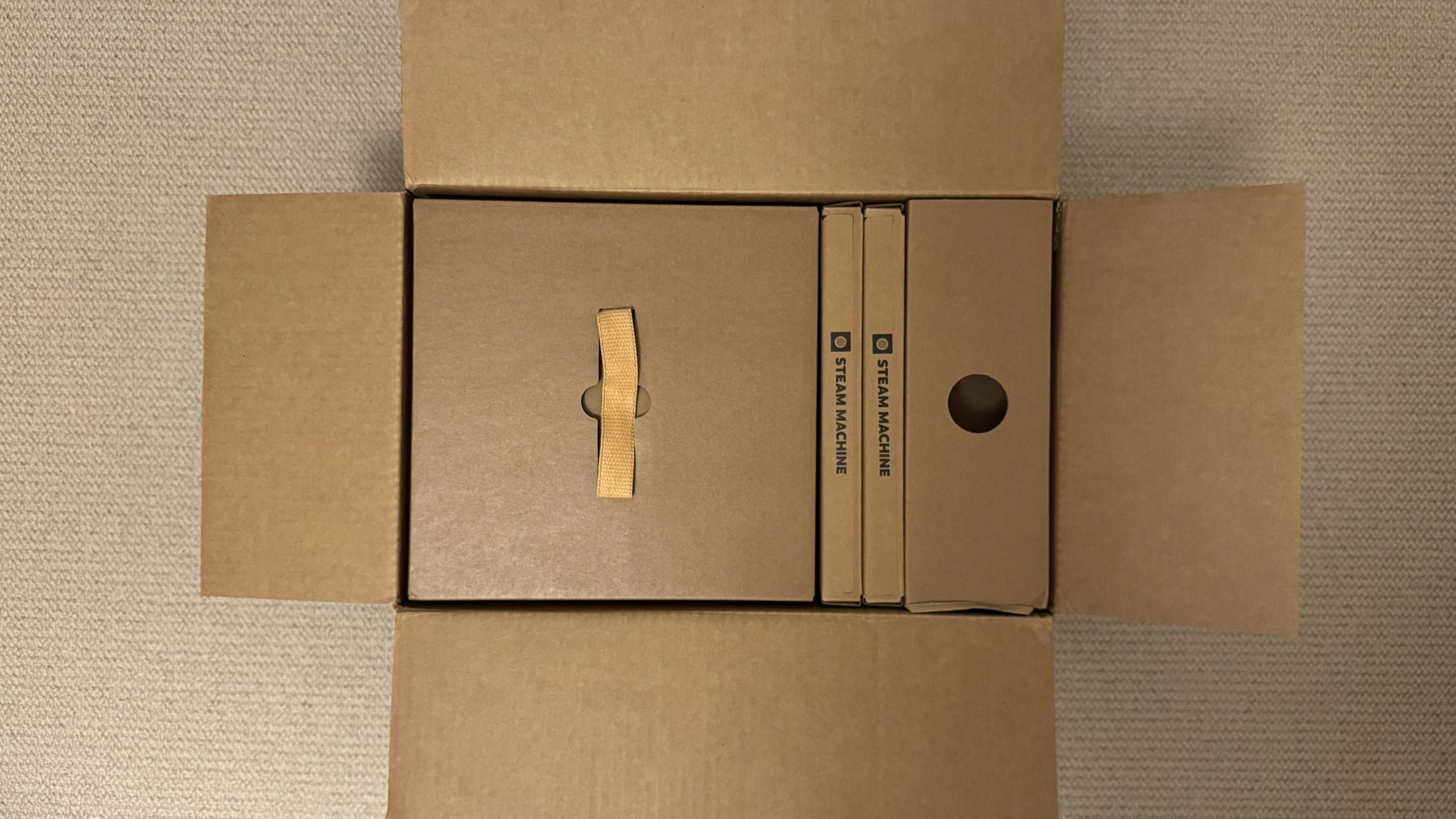 Photograph of the Steam Machine boxes as they arrive for shipping, outer box only opened, top down
