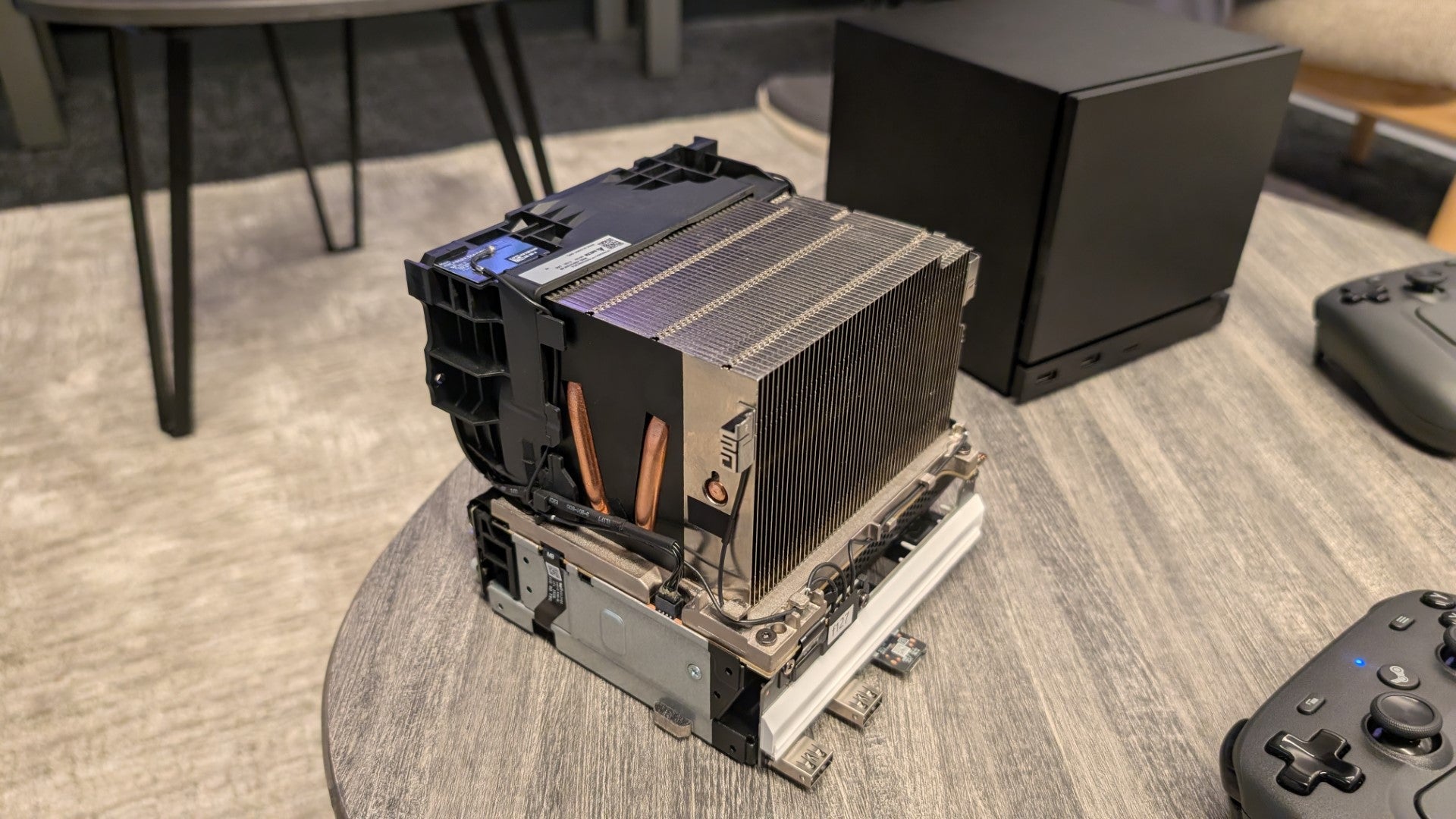 A 2026 Steam Machine with the exterior panels removed, revealing the cooling system and wireless antennae. - 3