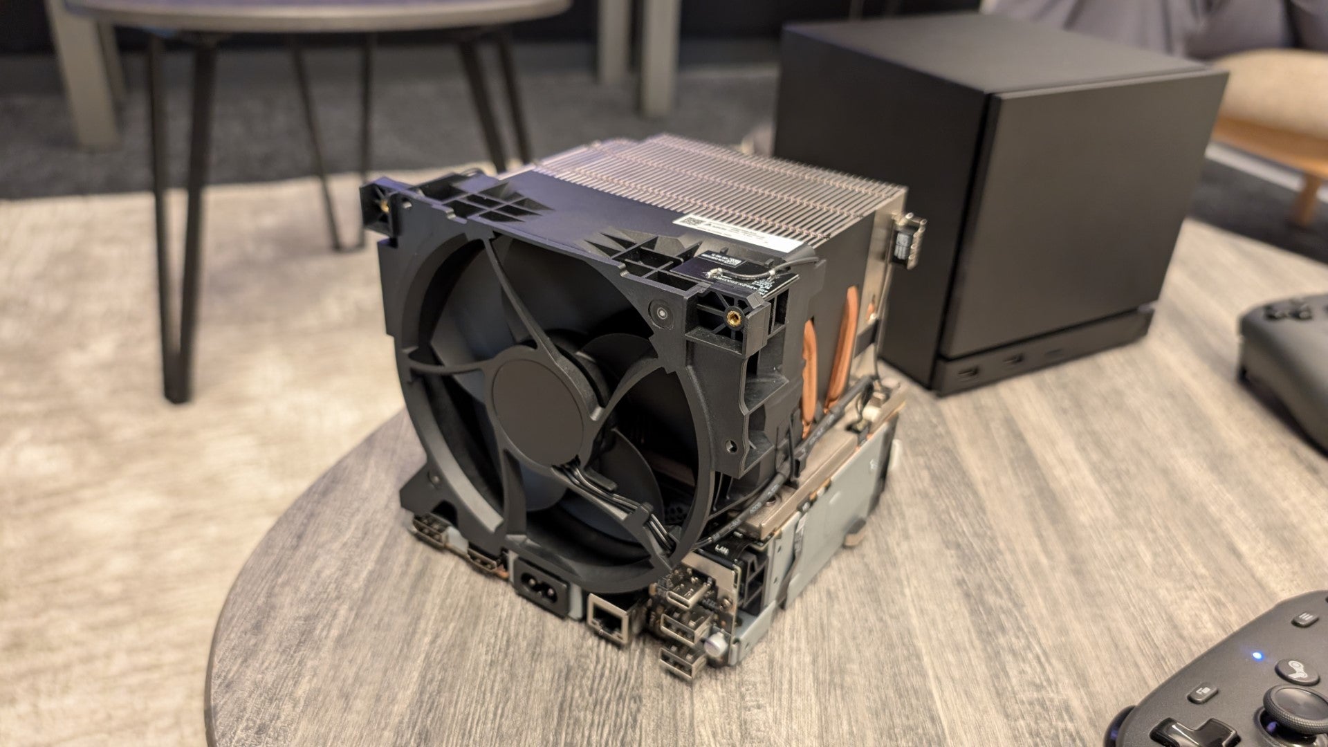 A 2026 Steam Machine with the exterior panels removed, revealing the cooling system and wireless antennae. - 5