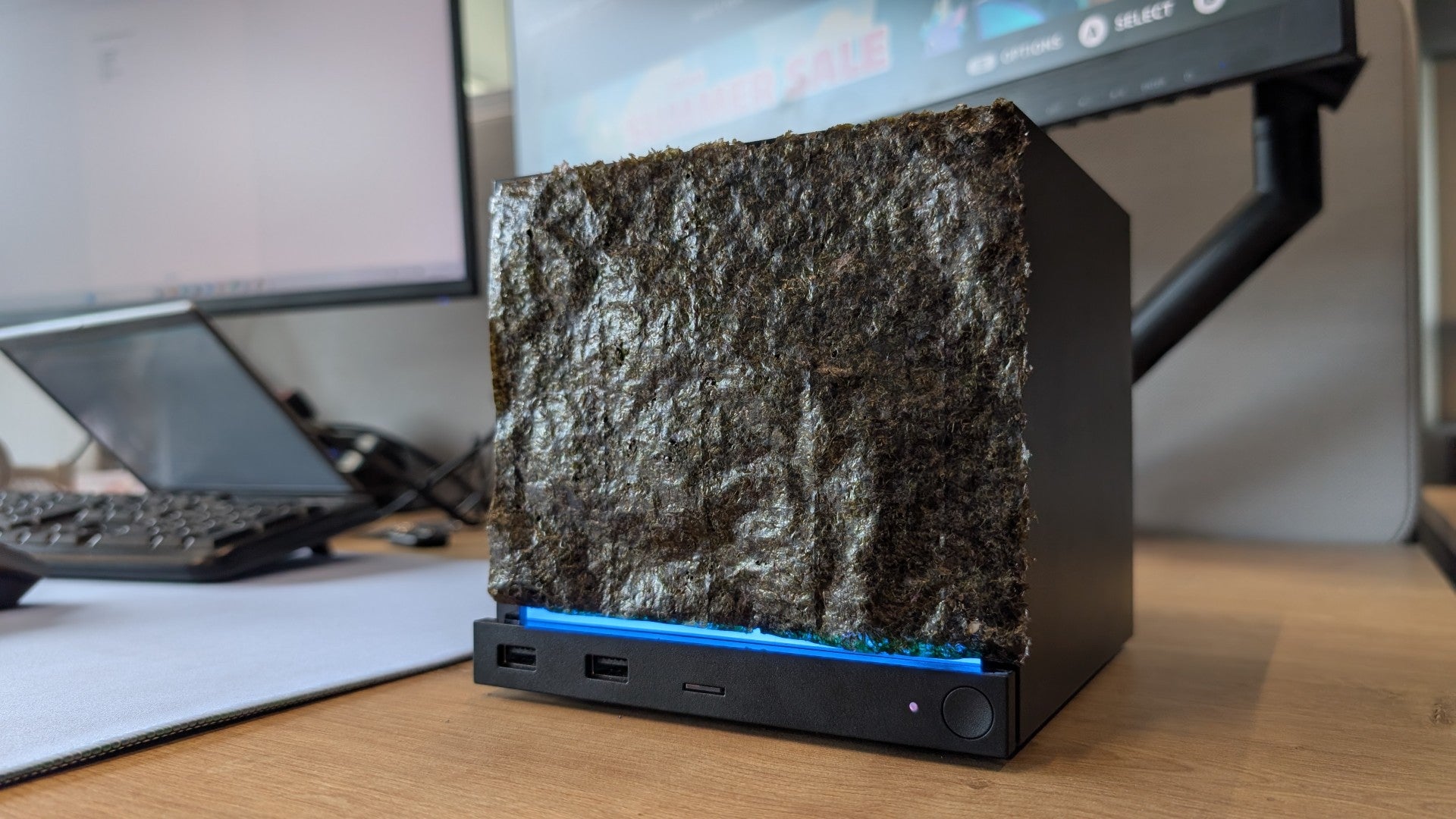 A Steam Machine with a sheet of nori seaweed acting as a faceplate.