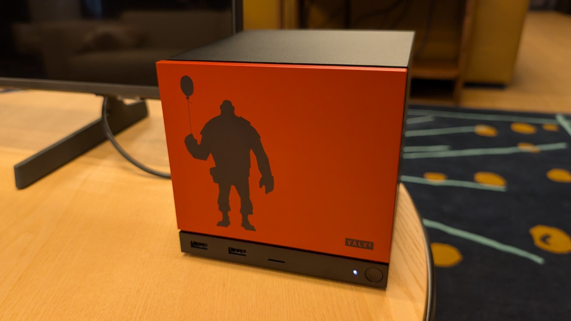 A Steam Machine with a custom faceplate depicting a silhouette of Team Fortress 2's Heavy, holding a balloon. - 6