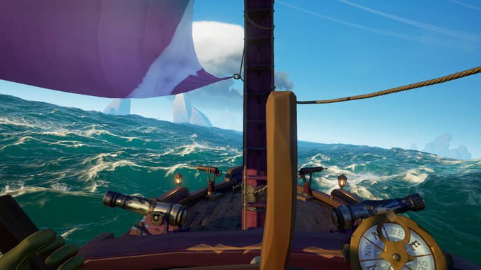 A view of the sea from the captain’s wheel of a ship in Sea of Thieves.