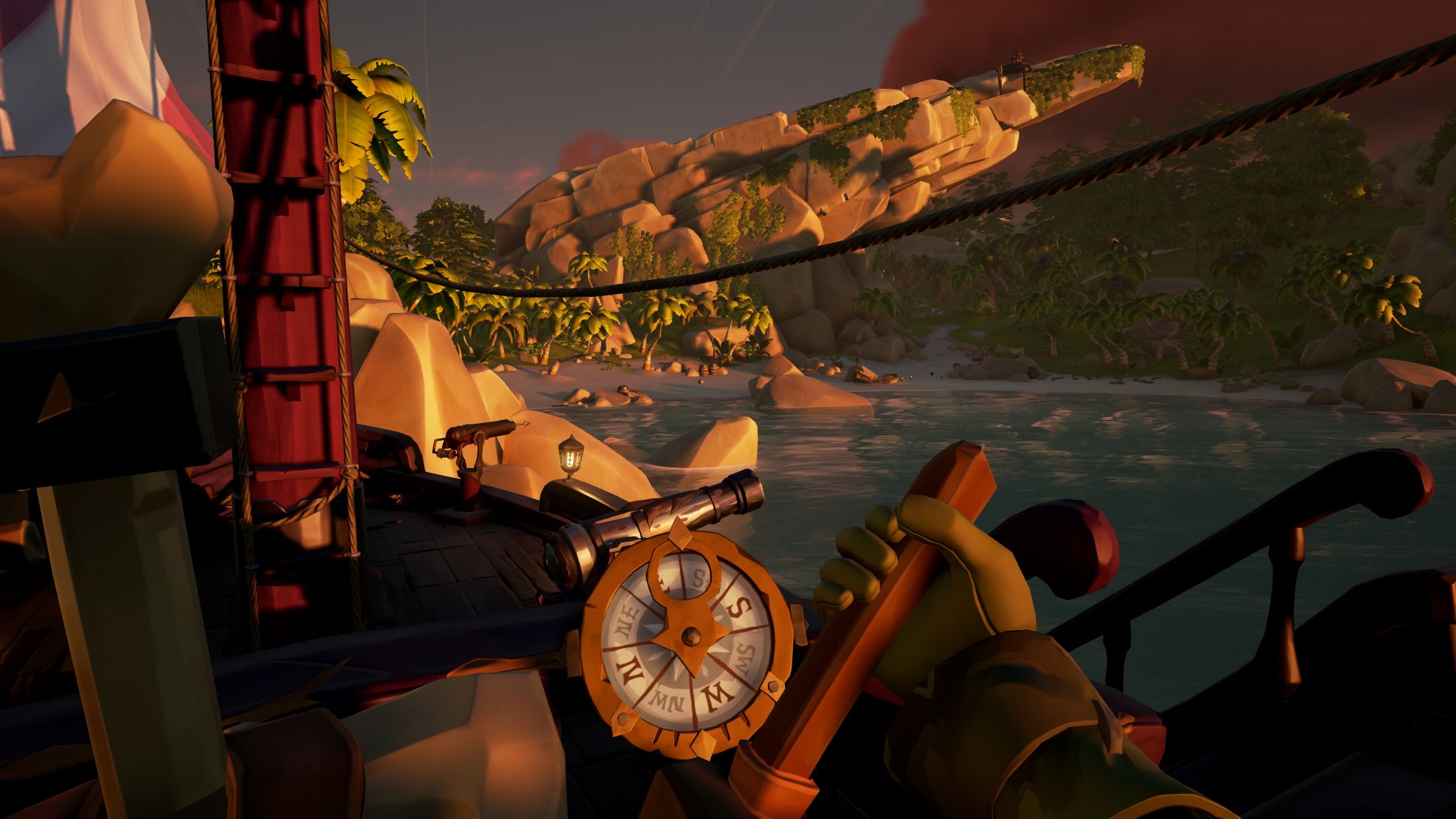A sailor pulls their boat up to the shore of a quiet island while looking at the compass on their captain&rsquo;s wheel in Sea of Theives.