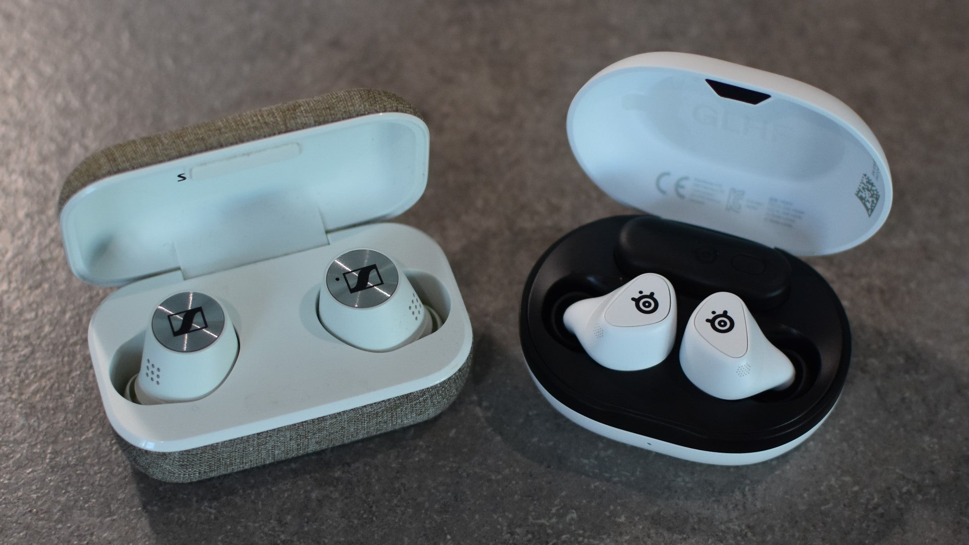 The SteelSeries Arctis GameBuds gaming earbuds next to Sennheiser's Momentum True Wireless 2 buds. - 4