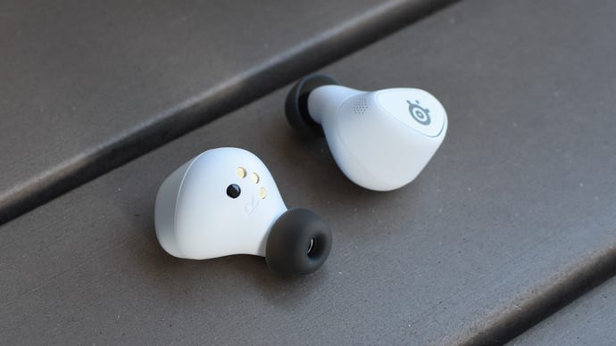 The SteelSeries Arctis GameBuds on a table.