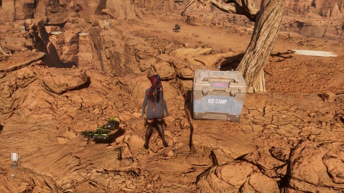 Eve beside a chest containing The Haven Green Tea Can in Stellar Blade.