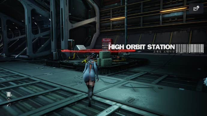 Eve from Stellar Blade looking at a Camp in the Spire 4 area.