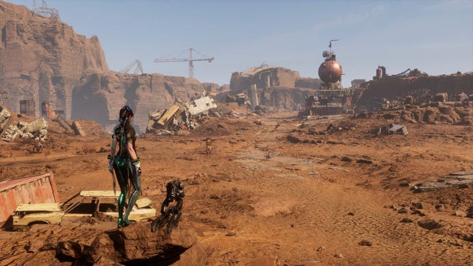 Eve with her drone in Stellar Blade looking across a sandy desert wasteland.