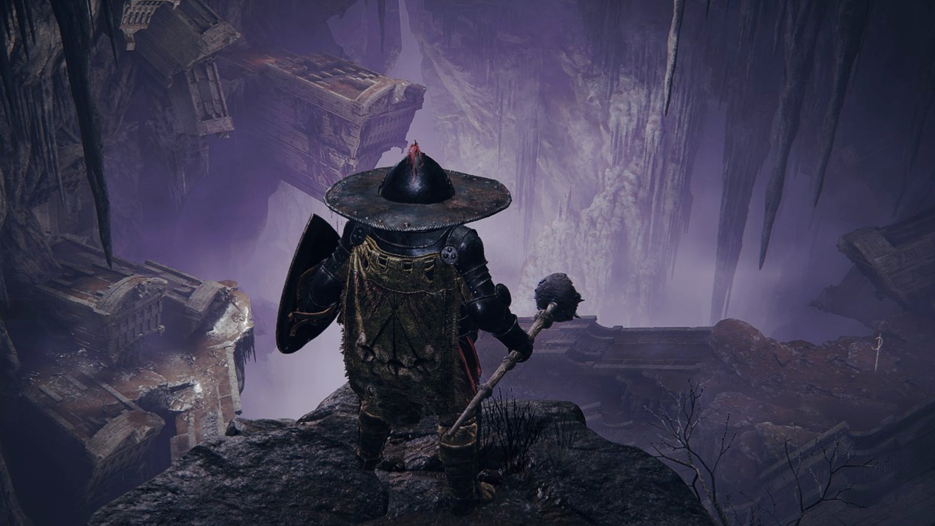 A Tarnished stands on the edge of the purple realm of Stone Coffin Fissure in Elden Ring: Shadow of the Erdtree. - 1
