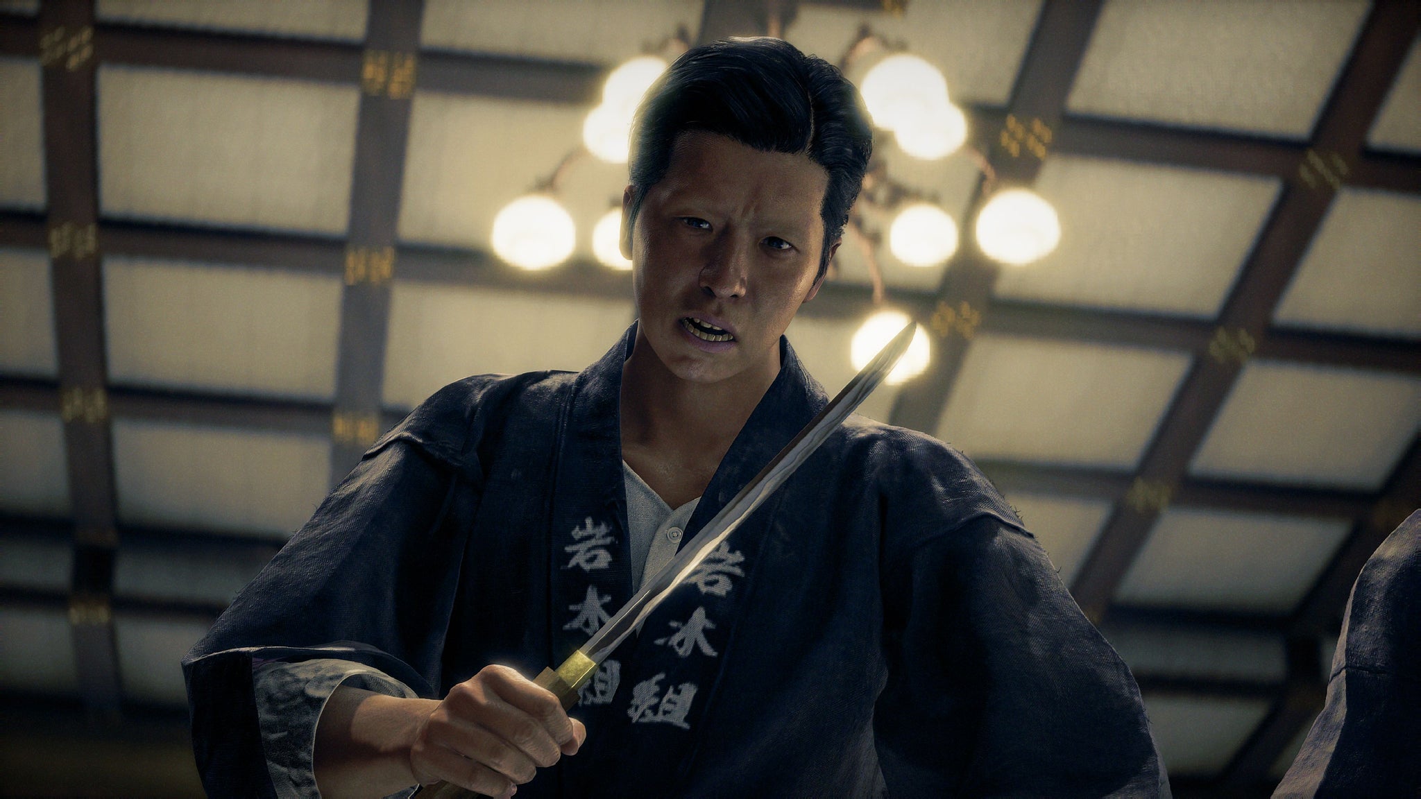 Stranger Than Heaven official image showing Suekichi, in a traditional robe holding a knife while looking down at you