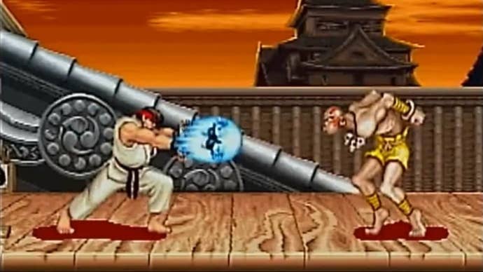 Street Fighter 2 screenshot showing Ryu firing hadouken at long-limbed Dhalsim