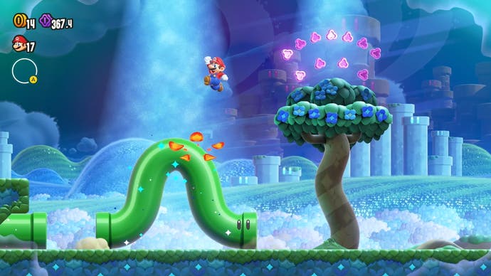 super mario bros wonder screenshot showing the pipes in the level coming alive after a wonder seed is collected