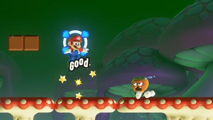 super mario bros wonder screenshot showing a goomba reacting with a terrified expression after his brother is jumped on and killed by Mario in front of his very eyes
