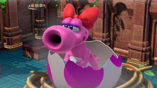 Birdo, in a pink bow, pops out of an egg that's decorated with purple splotches.