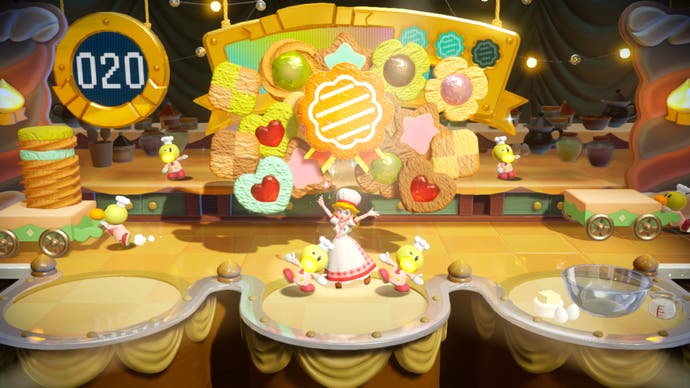 Princess Peach: Showtime screenshot showing a baking mini-game, with cakes on a conveyor belt.