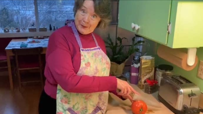 The voice actor of the adminstrator from TF2 menacingly slices a tomato