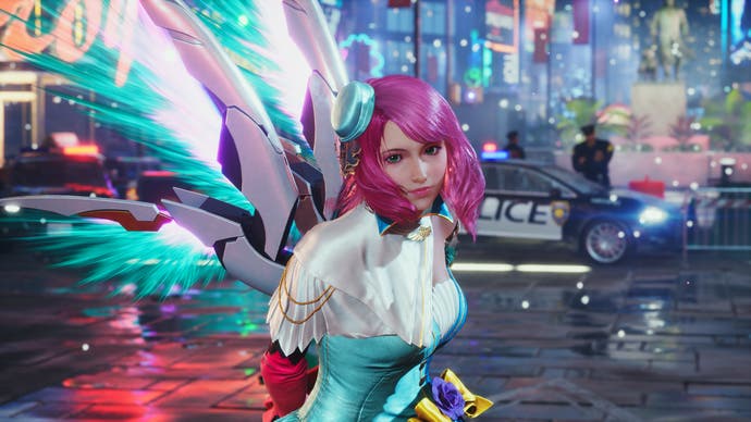 Tekken 8 screenshot showing Alisa looking towards the camera in front of a neon street background and police car