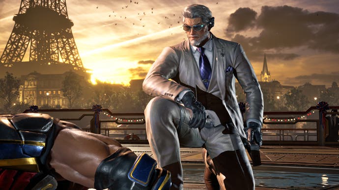 Tekken 8 screenshot showing Victor kneeling over a defeated enemy in front of the Eiffel Tower.