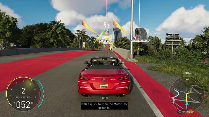 The Crew Motorfest screenshot, showing a red BMW Z4, pootling along in the open world, on its way to the Car Meet.