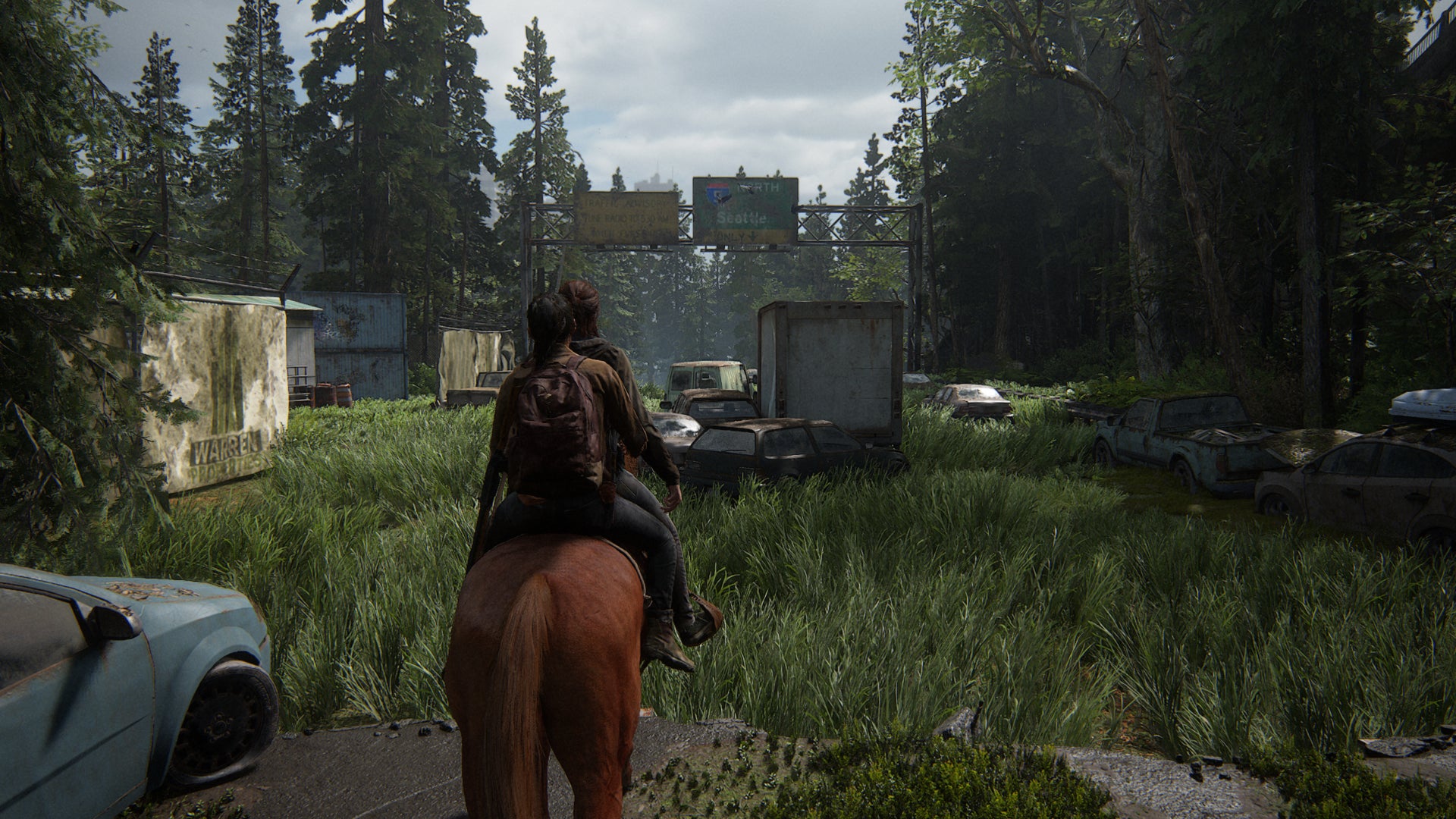 Ellie and Dina ride into Seattle on horseback, in The Last of Us Part II Remastered. - 3