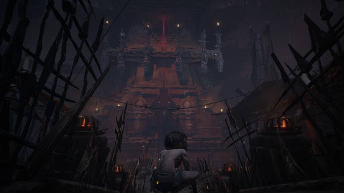 Gollum stands in front of a dark fortress in The Lord Of The Rings: Gollum