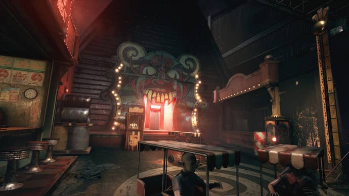 The player looks towards a funfair entrance in The Outlast Trials
