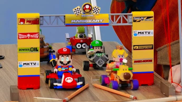 The start line of a fan made real life Mario Kart course with Lego racers