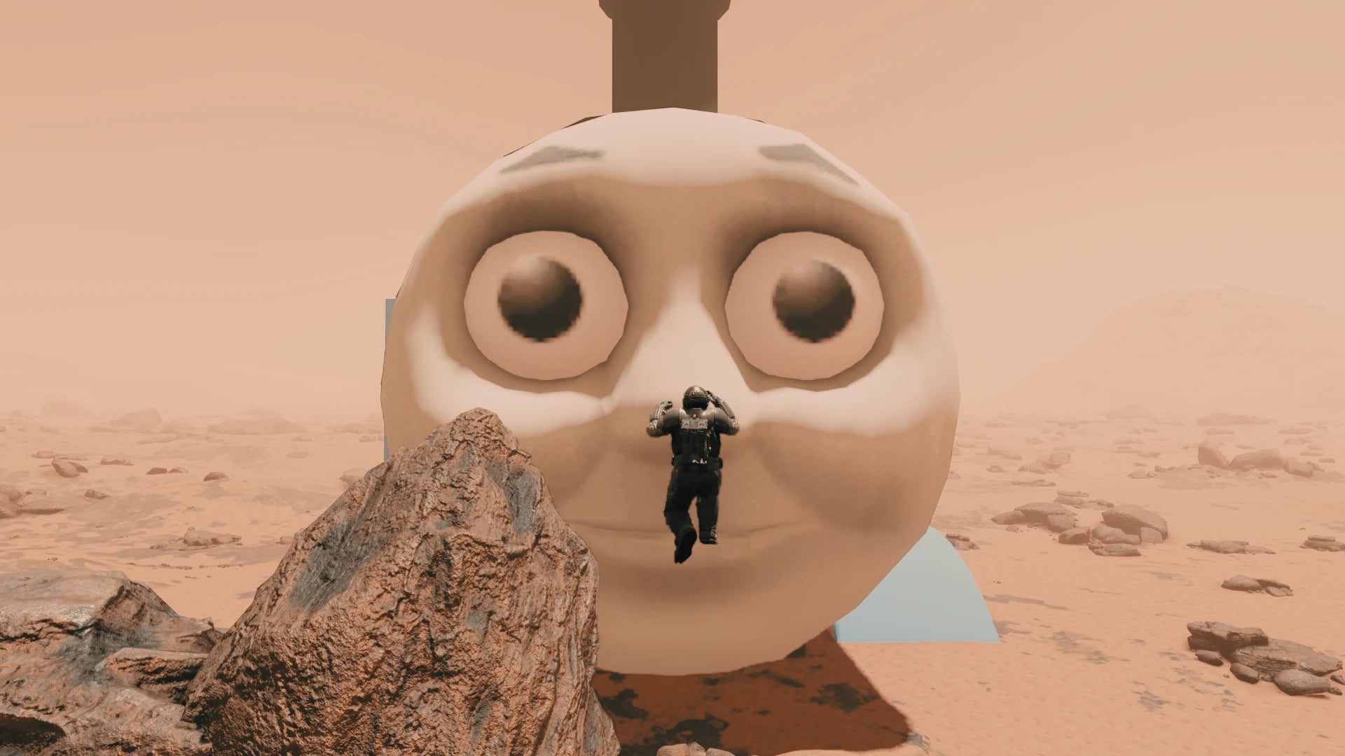 Thomas the Tank Engine's big, horrible face takes up most of the shot on a barren planet in Starfield. - 4