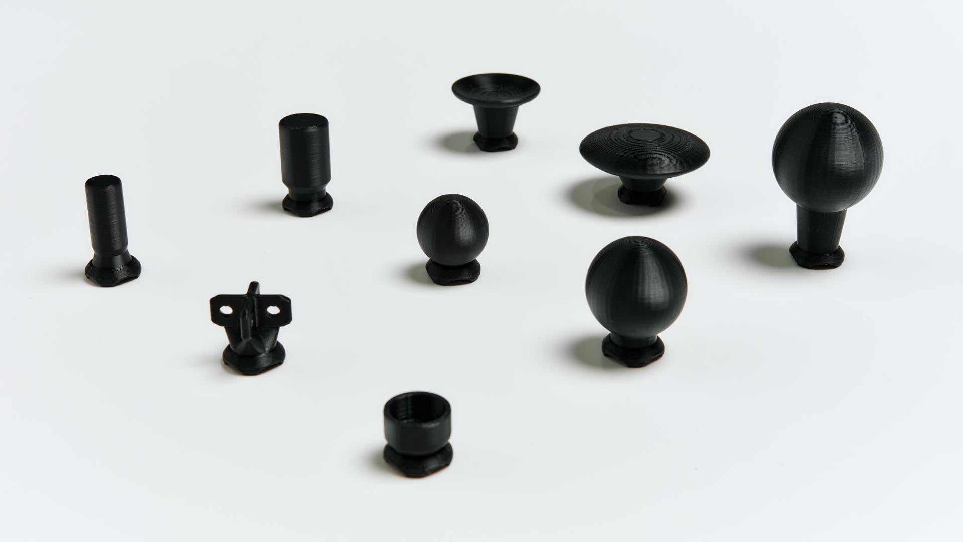 Collection of black 3D printed Xbox thumbstick toppers
