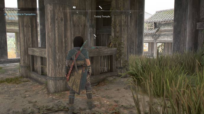 Naoe looking at a Lost Page at Todaiki Temple in Assassin’s Creed Shadows.