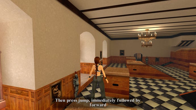 Lara stands at the edge of a vault box in a large ballroom in the original Tomb Raider