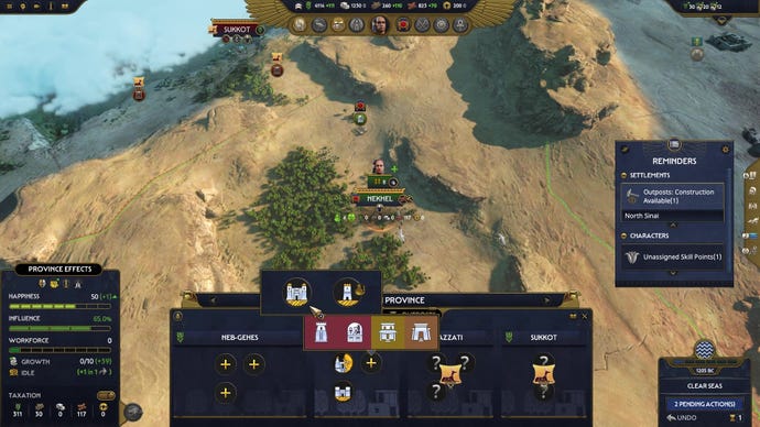 A top down view of the campaign map and its building menus in Total War: Pharaoh
