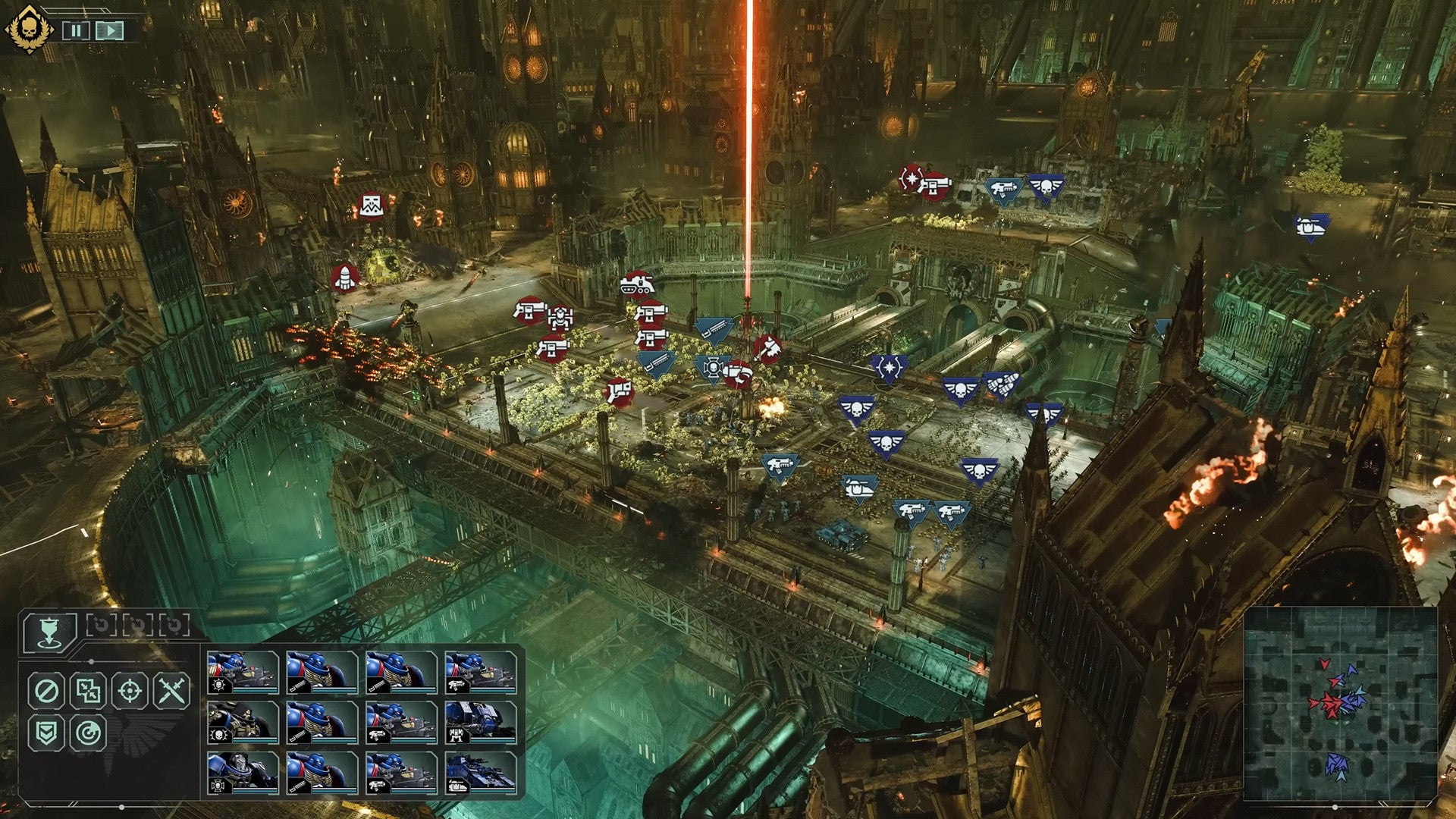 A battle in Total War: Warhammer 40,000, showing Ork and Space Marine armies clashing in a huge metal city. - 4
