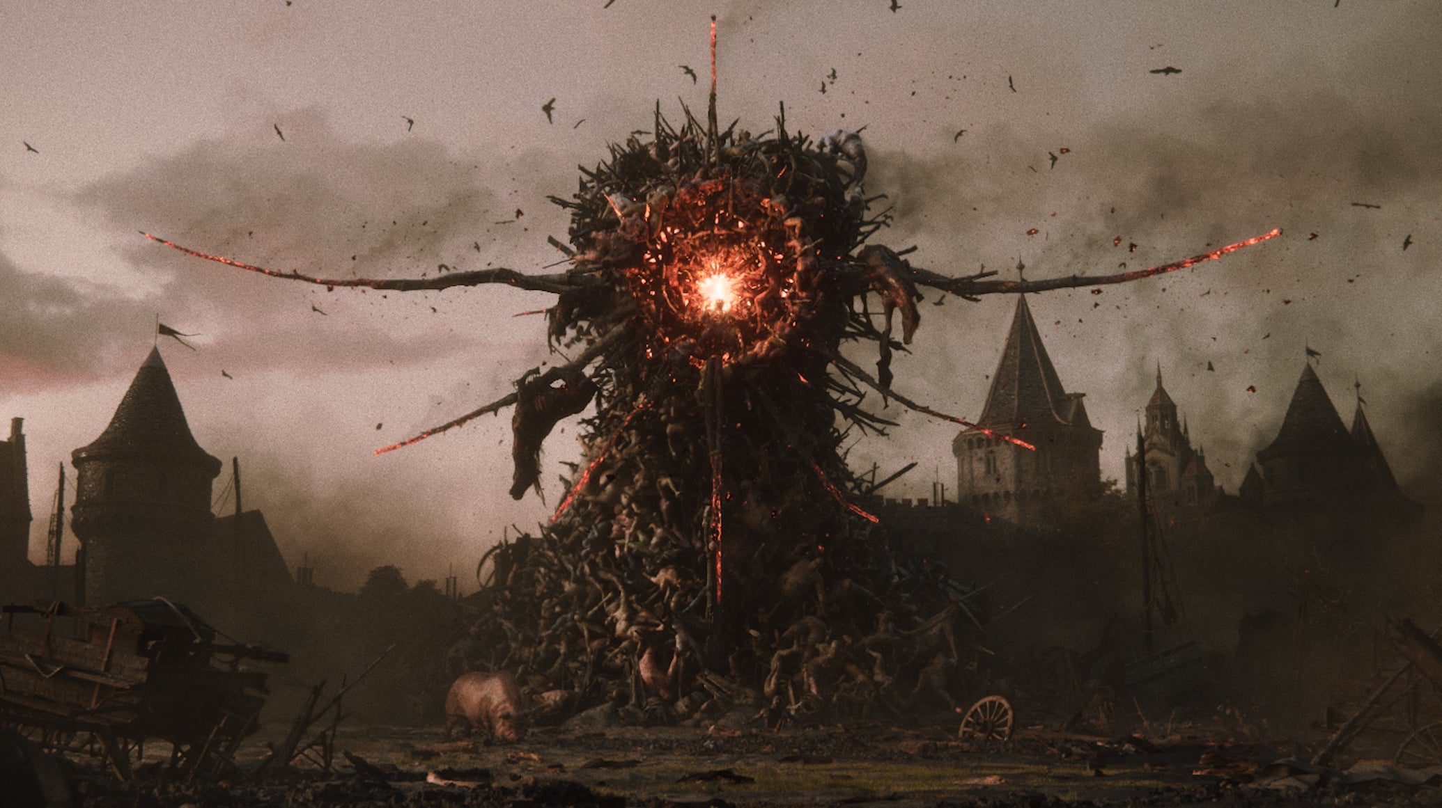 A big stack of fused corpses in Divinity, with a glowing eye-like red circle at the centre. - 1