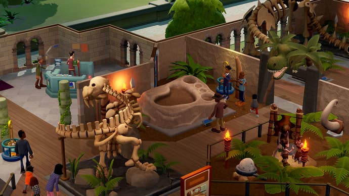 A prehistory expert inspects a giant foot fossil in Two Point Museum.