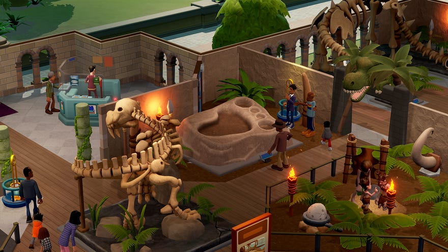 A prehistory expert inspects a giant foot fossil in Two Point Museum.