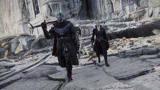Two characters in Elden Ring Nightreign walking towards the camera through a large white stoned courtyard like area
